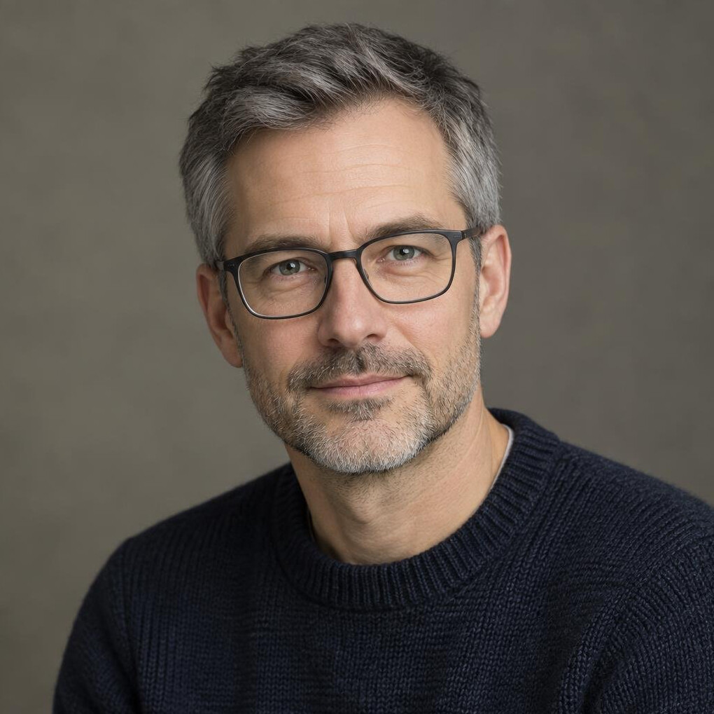 Studio portrait of a German man in his forties with glasses